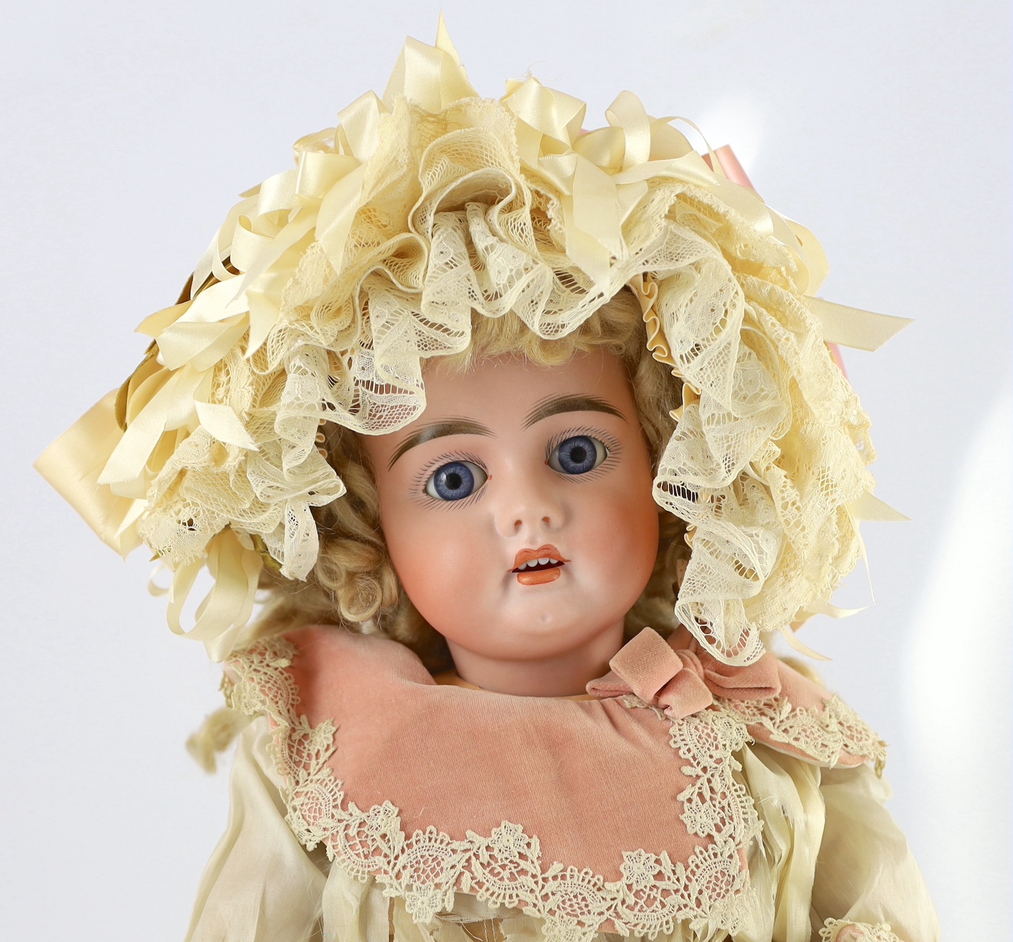 A fine and rare Frederick Edmund Winkler bisque doll, in original box, German, circa 1894-1899, 24in.